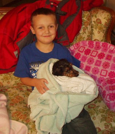 Elijah is holding his little brother :) hehe