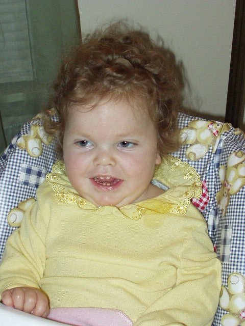 What a big girl! Look at those curls :)