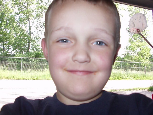 I wondered where all of these funny pictures came from until I found this one!!! Elijah took pictures of my tire, truck, garage and HIMSELF!!!!!