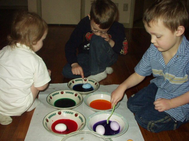 Timothy and Elijah were really careful with the eggs...Abigail just THREW *splash* them in the bowls!!