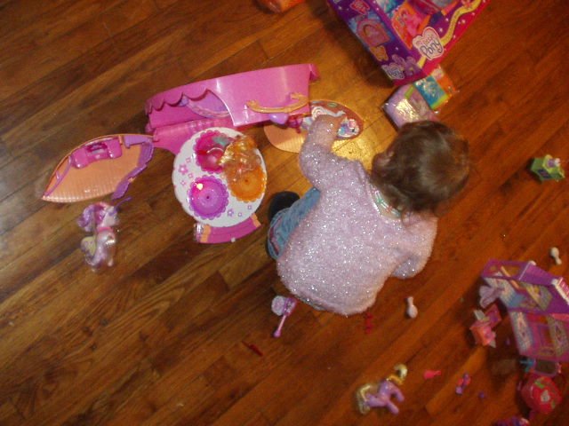 Abigail loves her new pony toys :) She tries to carry all of them around at one time :)
