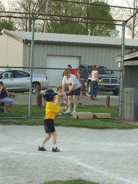 Mamaw and Abigail watch as Elijah is up to bat!! (more like Abigail eats popcorn!)