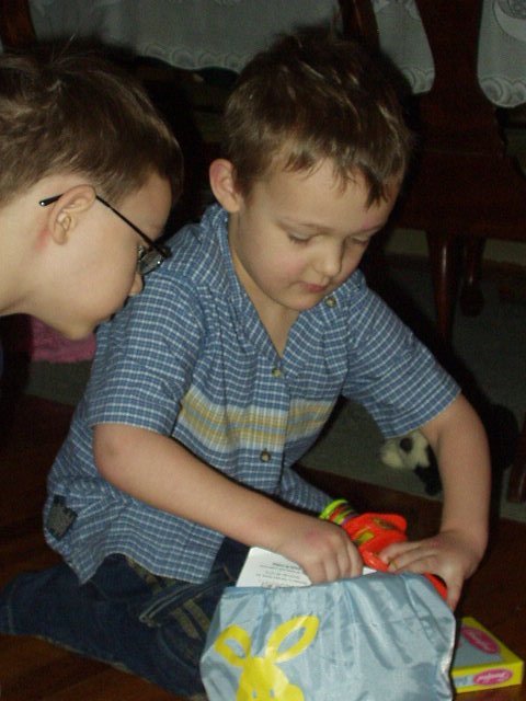 Elijah is showing Timothy what is in his basket!