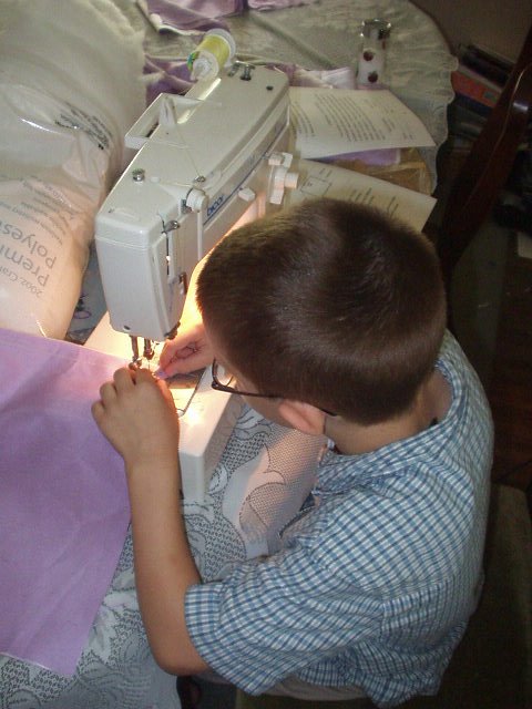 I'm trying NOT to sew my fingers into the pillow :)