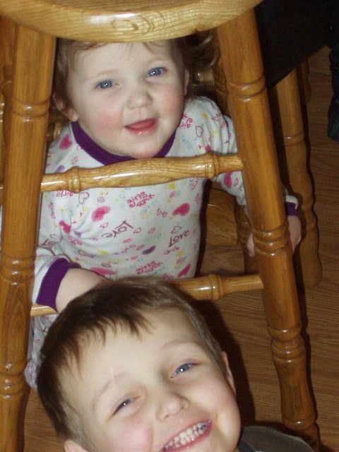 I'm not sure if it is safer for Abigail to sit on or stand under the chair :)