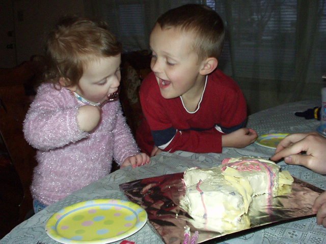 Abigail is eating cake right off the pan!