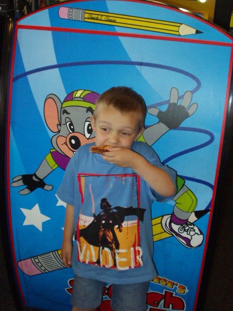For those of you that think Elijah will only eat chicken nuggets....here is proof that he likes pizza :) (hehe)