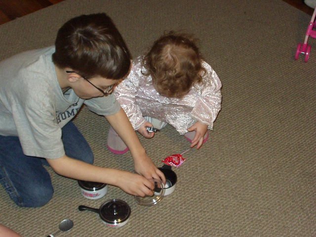 Timothy is helping Abigail with her pots and pans :)
