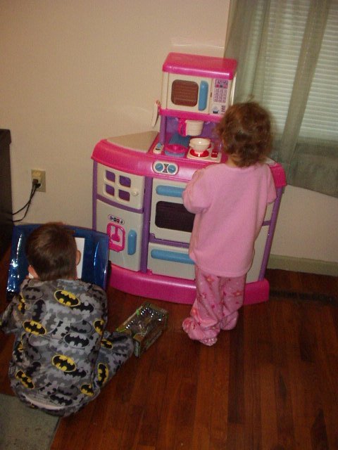 Abigail is cooking and Timothy is drawing Batman :)