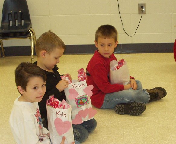 Elijah was trying to give back the cards that said "Elijah" on them. Probably because I had him write out his name on the cards that he gave away :)