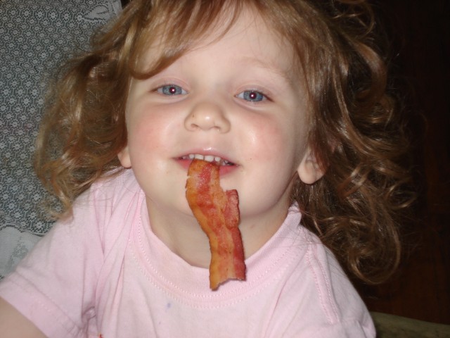 Abby loves her bacon!