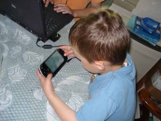 Elijah had fun with Timmy's PSP.