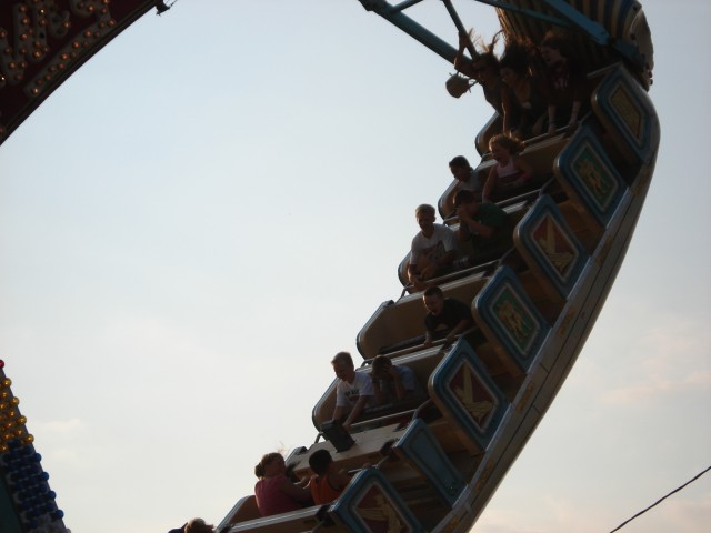 Timmy is in the seat by himself.