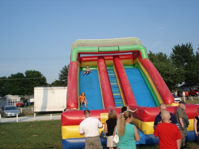Elijah bounces down the slide.