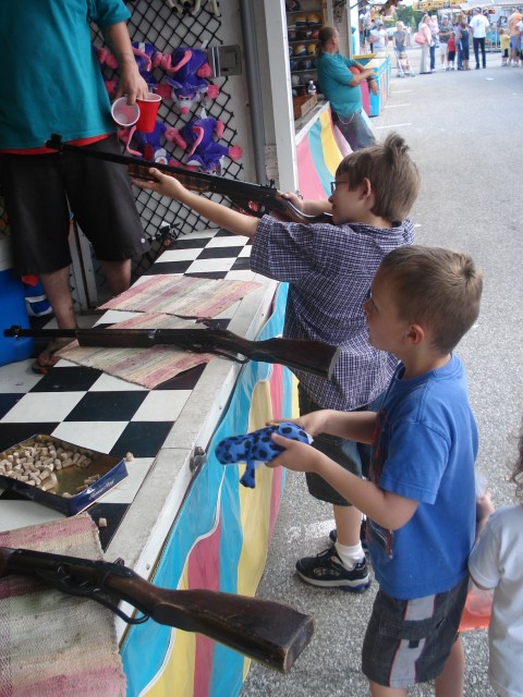 Elijah hit two cups on his first shot!  Apparently he only gets one prize though.  Hmm..