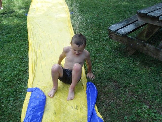 Elijah's knees are a little red from sliding on them.