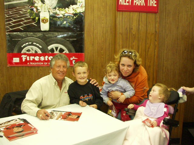 Cool!! Elijah is standing right next to Mario Andretti!!!
