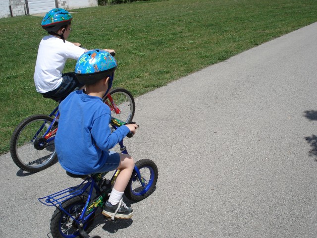 Elijah is a little too big for his bike from last summer.