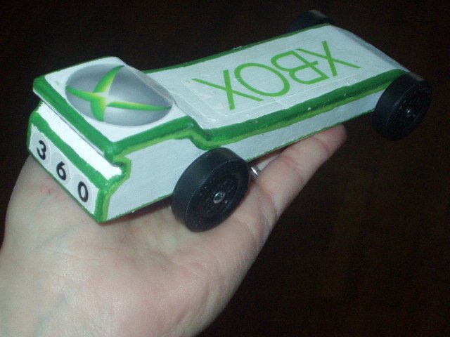 I had to hold the car so that you can see the '360' on the back. Timothy thought that was his best idea :) (the red ink on my hand is from going to Mamaw's work to weigh the car '3.4oz'- after adding fishing sinkers '4.6oz'..hehe)