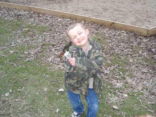 Elijah is the smilin-est little pistol whipper that you'll ever meet.