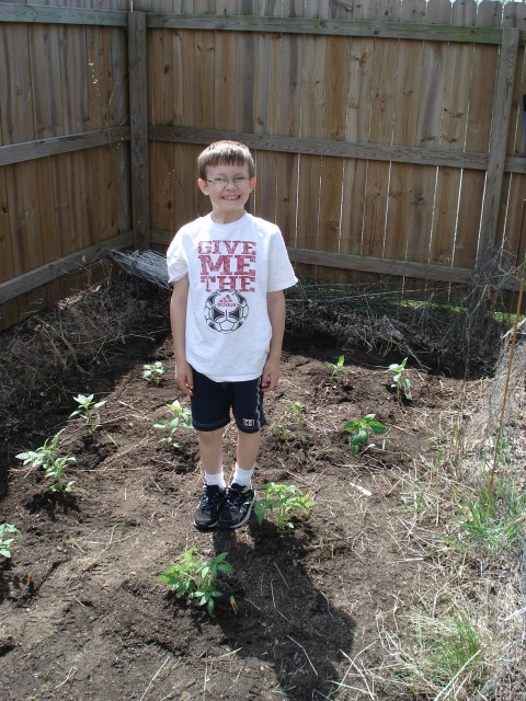 Timmy sure is a proud gardener.