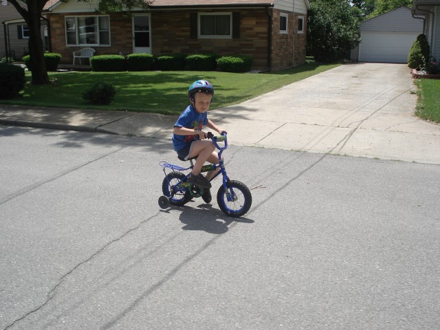 I think that's the "Would you freakin' get me a bigger bike??" look.
