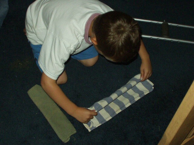 Elijah can fold towels really well! HE rocks!