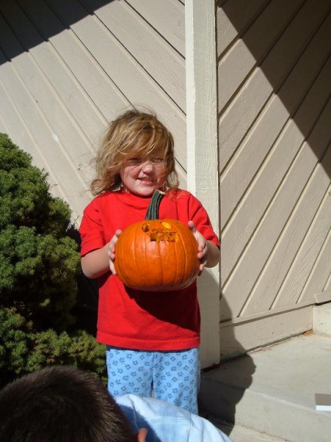Abby is proud of her pumpkin design!