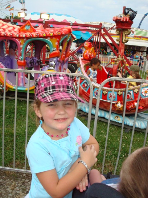 While the boys were off riding big-kid rides.. Abby got to go around and ride all of the fun girlie stuff :)