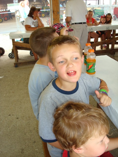 Elijah was excited about getting pizza at the fair!