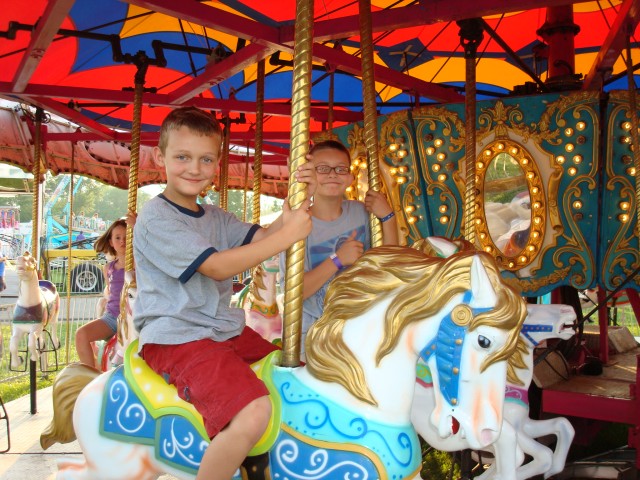I made them ride the merry-go-round because they wouldn't get on the "Balls of Fire" ride.