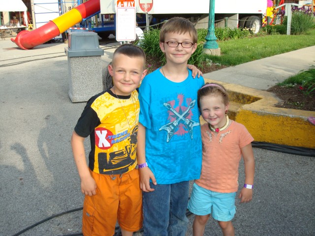 They're growing up so fast!  It seems like yesterday having Timmy ride the kiddy rides by himself.