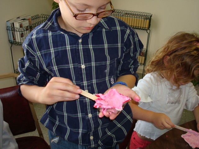 Timmy looks so serious making his pink chalk star.