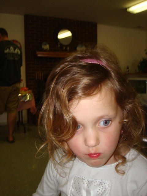 Abby is munching on a strawberry :)  Err.. oh, wait.. was that Play Dough?