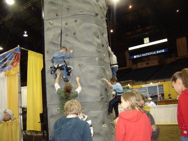 Elijah is in the middle.  He tried climbing up like 4 times!