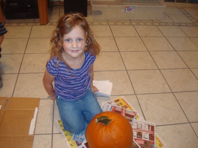 Abby is ready to carve her pumpkin!