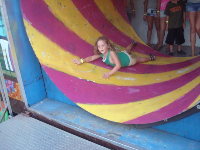 It wouldn't be a day at the carnival without Abigail laying down in the fun house tunnel!  ha