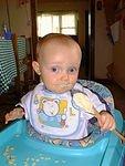 Elijah helped mommy with the dishes by eating the cookie dough off the spoon.