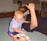 Elijah held Daddy and the baby down at the same time! What a strong little man :)