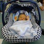 This is one week old Elijah sleeping during his uncle's High School Graduation reception.  (May `00)