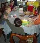 Timothy was trying to stop Elijah from blowing out the candles :O