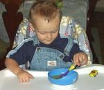 These 3 pictures are proof that Elijah does eat. Even though he is a big boy, he doesn't like to sit down and eat.