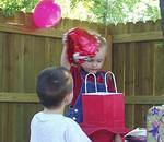 Timothy wanted to help Elijah open his gifts.