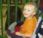 Elijah was sitting next to Uncle Bruce's piggy.