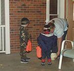 Timothy would open his bag for the candy...Elijah made the people work :) hehe