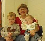 Elijah, Mamaw and Mary at Elijah's Christmas party. Mary is wondering where her other hand is :):)