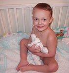 Elijah likes to climb into the crib and act like a baby :)