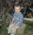 I think Elijah looks a lot like his Daddy in this picture.