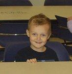 Elijah is ready to eat his snack after going to the pumpkin patch.