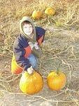 Timothy with his pumpkin that he picked out.